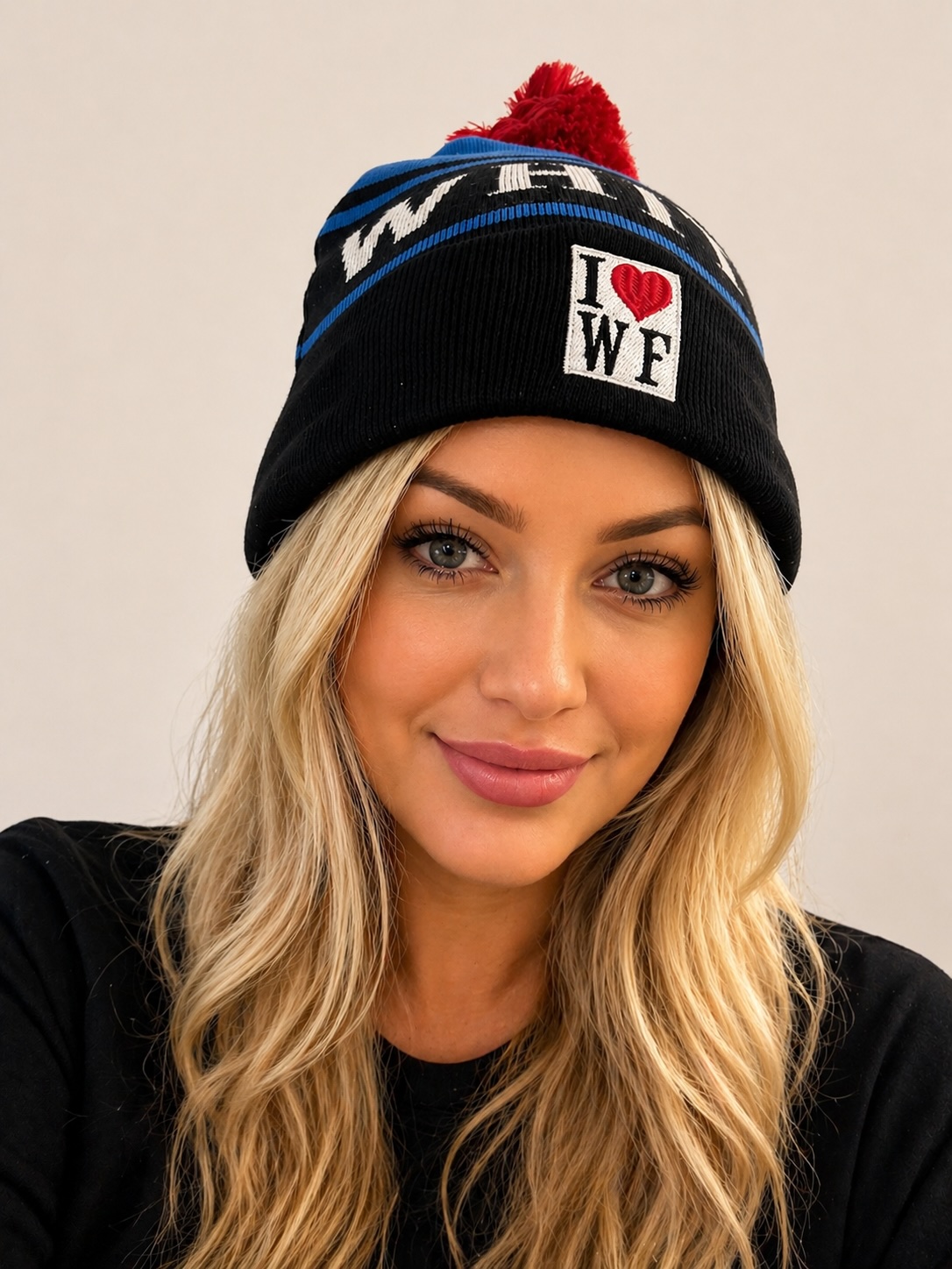 Whitefish Beanie - Black knit with blue stripes and red pompom